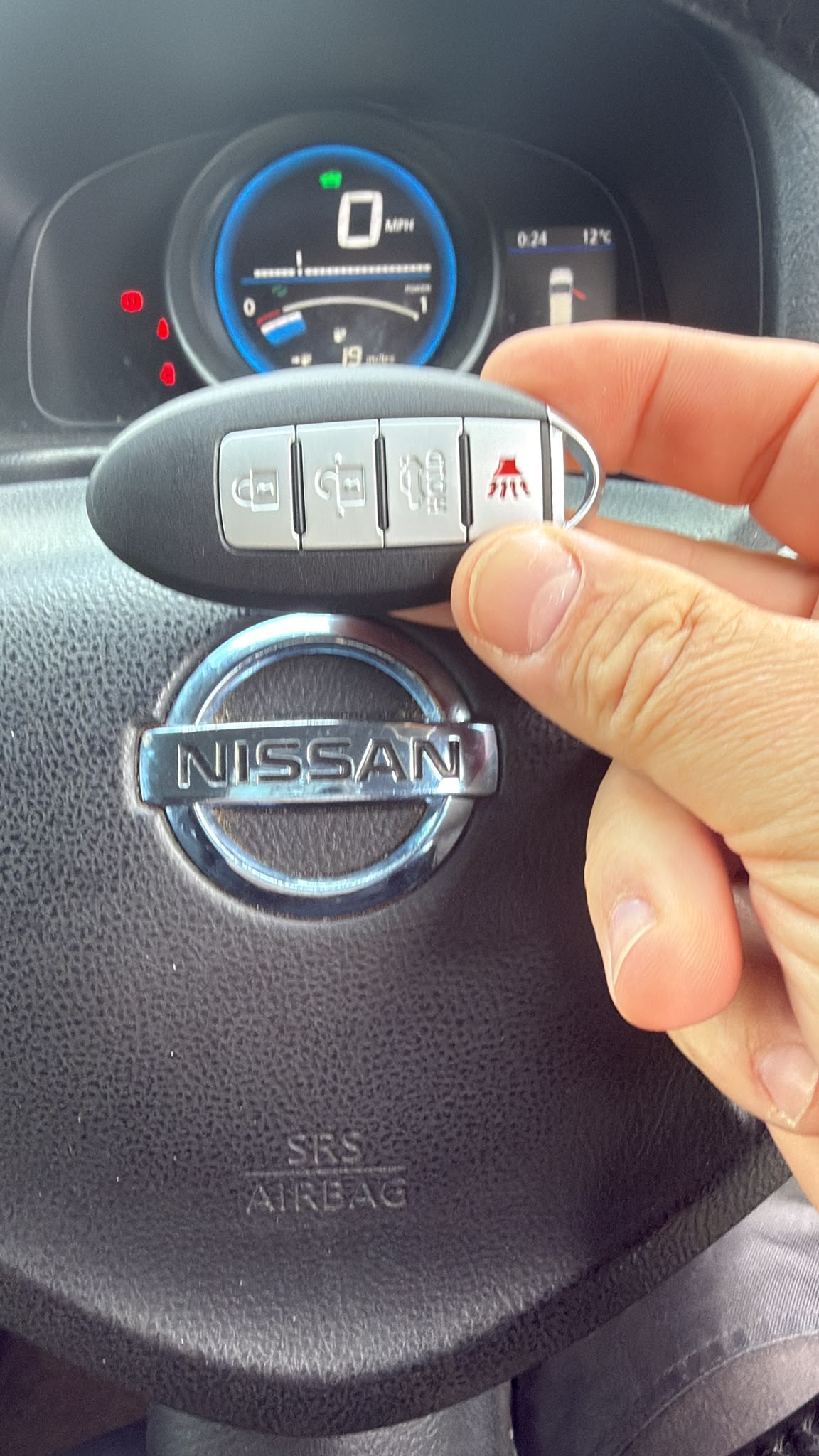 Close-up of a replacement key made for a Nissan NV200 electric van